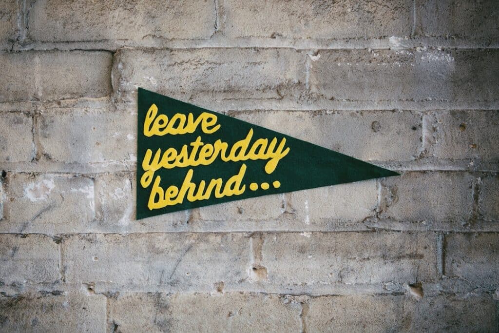 A pennant on the wall with the words "leave yesterday behind...".